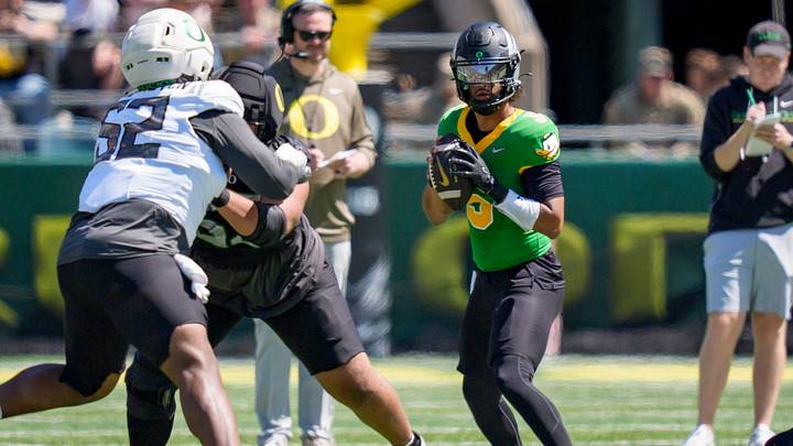 Combat Ducks quarterback Dante Moore looks to pass during the Oregon Ducks annual spring game on April 25, 2026 at Autzen Stadium in Eugene, Oregon.