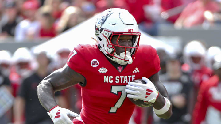 Nov 2, 2024; Raleigh, North Carolina, USA; North Carolina State Wolfpack saftey Bishop Fitzgerald (7) runs the ball during the first quarter against Stanford Cardinals at Carter-Finley Stadium. Mandatory Credit: Zachary Taft-Imagn Images Nov 2, 2024; Raleigh, North Carolina, USA; North Carolina State Wolfpack saftey Bishop Fitzgerald (7) runs the ball during the first quarter against Stanford Cardinals at Carter-Finley Stadium. Mandatory Credit: Zachary Taft-Imagn Images