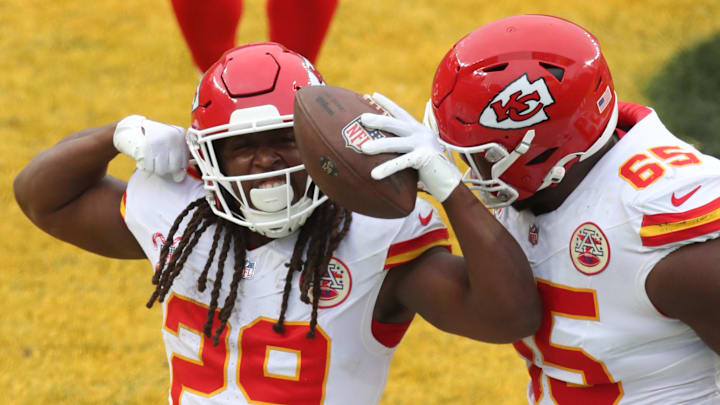 Dec 25, 2024; Pittsburgh, Pennsylvania, USA;  Kansas City Chiefs running back Kareem Hunt (29) reacts with guard Trey Smith (65) after Hunt scored a touchdown against the Pittsburgh Steelers during the fourth quarter at Acrisure Stadium. Mandatory Credit: Charles LeClaire-Imagn Images