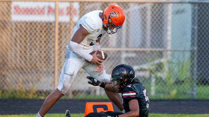 Benjamin wide reciever Amaree Williams taunts 
Palm Beach Central cornerback Mikey Gayle
during