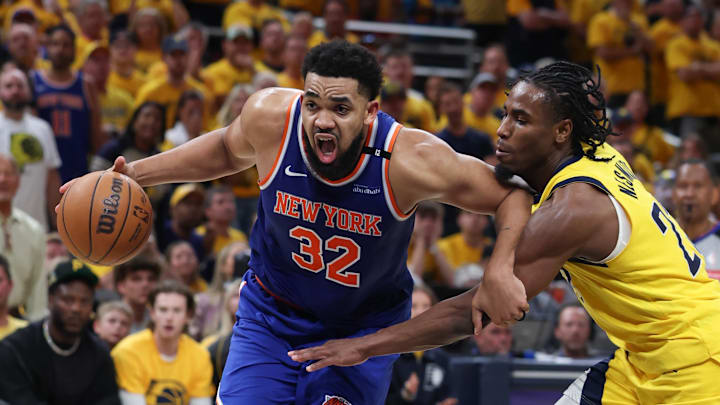 New York Knicks center Karl-Anthony Towns drives to the basket against Indiana Pacers guard Andrew Nembhard. Mandatory Credit: Trevor Ruszkowski-Imagn Images