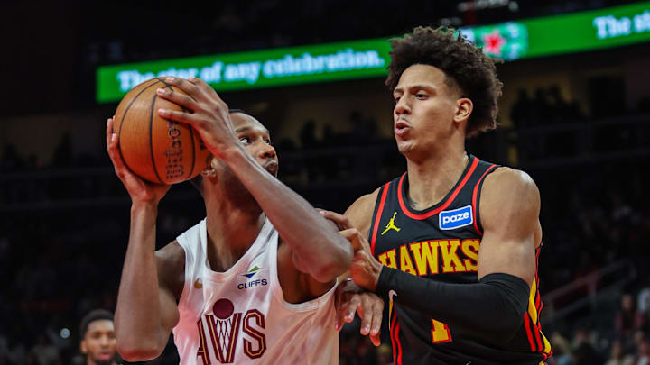 Nov 28, 2025; Atlanta, Georgia, USA; Cleveland Cavaliers center Evan Mobley (4) looks for the shot against Atlanta Hawks forward Jalen Johnson (1) during the third quarter at State Farm Arena. Mandatory Credit: Jordan Godfree-Imagn Images