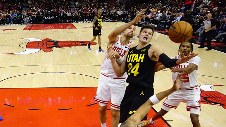 Nov 4, 2024; Chicago, Illinois, USA; Chicago Bulls forward Julian Phillips (15) defends Utah Jazz center Walker Kessler (24) during the second half at United Center. Mandatory Credit: David Banks-Imagn Images