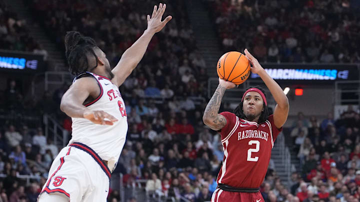Mar 22, 2025; Providence, RI, USA; Arkansas Razorbacks guard Boogie Fland (2) shoots against St. John's Red Storm forward Zuby Ejiofor (24) during the second half of a second round men’s NCAA Tournament game at Amica Mutual Pavilion. Mandatory Credit: Gregory Fisher-Imagn Images