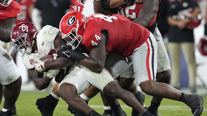 Sep 27, 2025; Athens, Georgia, USA; Georgia Bulldogs defensive lineman Jordan Hall (44) tackles Alabama Crimson Tide running back Jam Miller (26) in the fourth quarter at Sanford Stadium. Mandatory Credit: Dale Zanine-Imagn Images