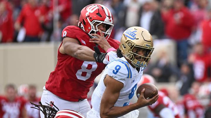 Oct 25, 2025; Bloomington, Indiana, USA; UCLA Bruins quarterback Nico Iamaleava (9) runs with the ball against Indiana Hoosiers defensive lineman Stephen Daley (8) during the second half at Memorial Stadium. Mandatory Credit: Robert Goddin-Imagn Images Oct 25, 2025; Bloomington, Indiana, USA; UCLA Bruins quarterback Nico Iamaleava (9) runs with the ball against Indiana Hoosiers defensive lineman Stephen Daley (8) during the second half at Memorial Stadium. Mandatory Credit: Robert Goddin-Imagn Images
