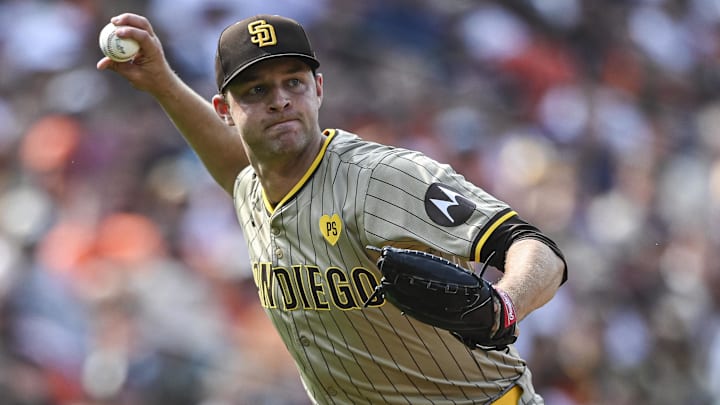 Jul 27, 2024; Baltimore, Maryland, USA; San Diego Padres pitcher Michael King (34) throws to first base after fielding Baltimore Orioles shortstop Gunnar Henderson (2) first inning ground ball  at Oriole Park at Camden Yards. Mandatory Credit: Tommy Gilligan-USA TODAY Sports
