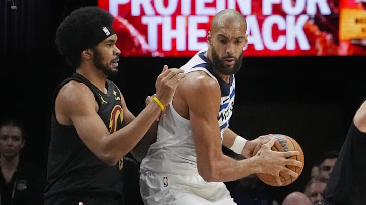 Jan 8, 2026; Minneapolis, Minnesota, USA; Cleveland Cavaliers center Jarrett Allen (31) defends against Minnesota Timberwolves center Rudy Gobert (27) him in the first quarter at Target Center. Mandatory Credit: Bruce Kluckhohn-Imagn Images