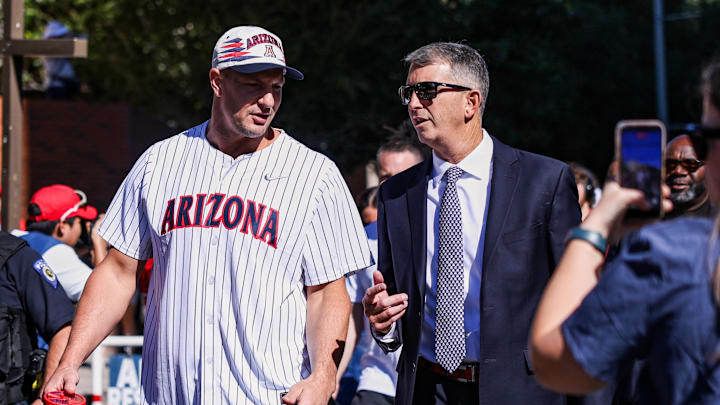 Oct 4, 2025; Tucson, Arizona, USA; Former professional and University of Arizona football player Rob Gronkowski walks down the Wildcat Walk with head coach Brent Brennan before the game against the Oklahoma State Cowboys at Arizona Stadium. Mandatory Credit: Aryanna Frank-Imagn Images