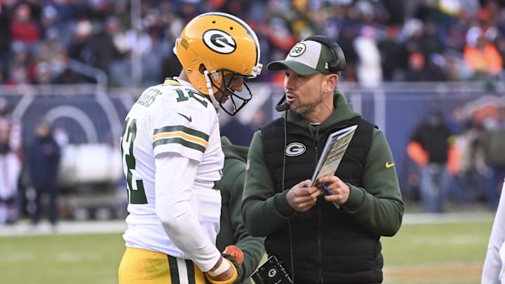 Dec 4, 2022; Chicago, Illinois, USA;  Green Bay Packers head coach Matt LaFleur and quarterback Aaron Rodgers (12) talk during the second half against the Chicago Bears at Soldier Field. Mandatory Credit: Matt Marton-Imagn Images