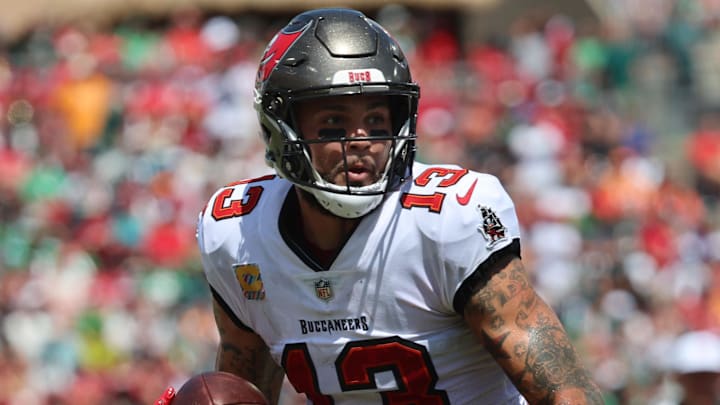 Sep 29, 2024; Tampa, Florida, USA; Tampa Bay Buccaneers wide receiver Mike Evans (13) runs with the ball against the Philadelphia Eagles during the first half at Raymond James Stadium. Mandatory Credit: Kim Klement Neitzel-Imagn Images
