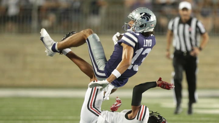Kansas State sophomore wide receiver Xavier Loyd (13) rolls over Southeast Missouri State cornerback Ty Leonard in the third quarter of Saturday's game inside Bill Snyder Family Stadium.