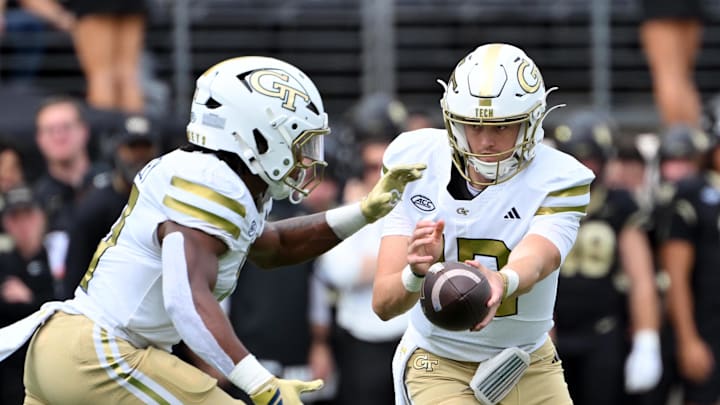 Sep 27, 2025; Winston-Salem, North Carolina, USA; Georgia Tech Yellow Jackets quarter back Haynes King (10) hands the ball to running back Malachi Hosley (0) during the first quarter against the Wake Forest Demon Deacons at Allegacy Federal Credit Union Stadium. Mandatory Credit: Zachary Taft-Imagn Images Sep 27, 2025; Winston-Salem, North Carolina, USA; Georgia Tech Yellow Jackets quarter back Haynes King (10) hands the ball to running back Malachi Hosley (0) during the first quarter against the Wake Forest Demon Deacons at Allegacy Federal Credit Union Stadium. Mandatory Credit: Zachary Taft-Imagn Images