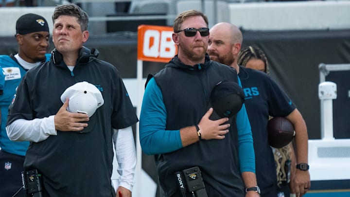 Jacksonville Jaguars head coach Liam Coen stands with his hat over his heart during the playing of the National Anthem before an NFL scrimmage at EverBank Stadium Friday August 1, 2025, in Jacksonville, Fla. [Doug Engle/Florida Times-Union]