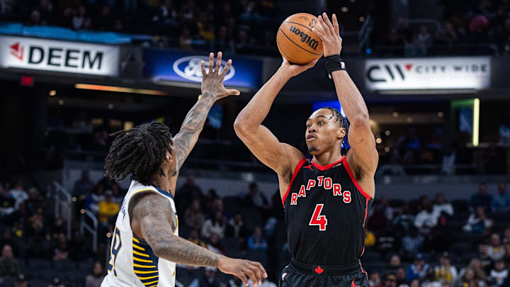 Jan 14, 2026; Indianapolis, Indiana, USA; Toronto Raptors forward/guard Scottie Barnes (4) shoots the ball while Indiana Pacers guard Quenton Jackson (29)  defends in the first half at Gainbridge Fieldhouse. Mandatory Credit: Trevor Ruszkowski-Imagn Images