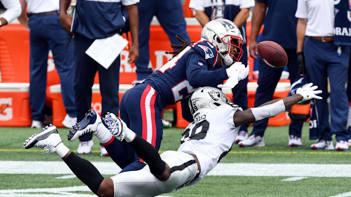 Sep 27, 2020; Foxborough, Massachusetts, USA; New England Patriots cornerback Stephon Gilmore (24) breaks up a pass intended for Las Vegas Raiders wide receiver Bryan Edwards (89) during the first quarter at Gillette Stadium. 