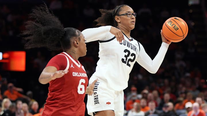 Oklahoma State guard Stailee Heard (32) passes the ball away from Oklahoma forward Sahara Williams (6) during the first half of a Bedlam women's college basketball game between the OSU Cowgirls and OU Sooners at Paycom Center in Oklahoma City, Saturday, Dec. 13, 2025.