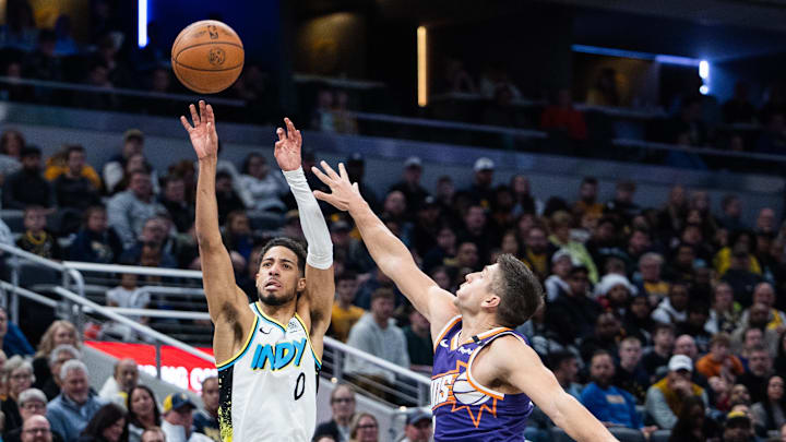 Jan 4, 2025; Indianapolis, Indiana, USA; Indiana Pacers guard Tyrese Haliburton (0) shoots the ball against Phoenix Suns guard Grayson Allen (8) in the second half at Gainbridge Fieldhouse. Mandatory Credit: Trevor Ruszkowski-Imagn Images