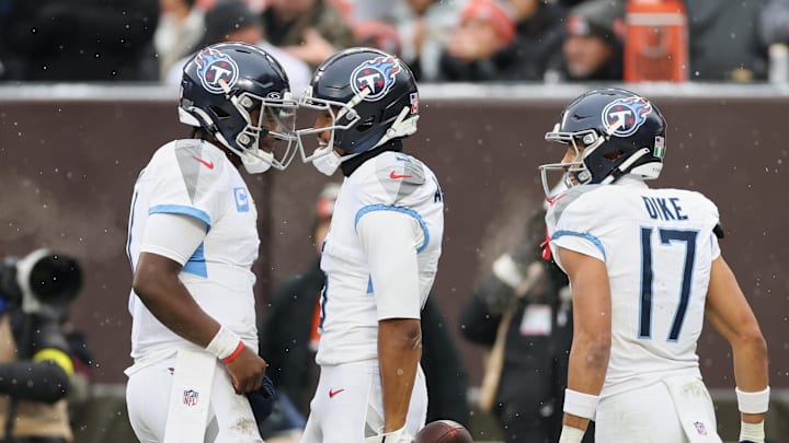Dec 7, 2025; Cleveland, Ohio, USA; Tennessee Titans wide receiver Elic Ayomanor (5) celebrates with quarterback Cam Ward (1) and wide receiver Chimere Dike (17) after catching a touchdown pass against the Cleveland Browns during the first quarter at Huntington Bank Field. Mandatory Credit: Scott Galvin-Imagn Images Dec 7, 2025; Cleveland, Ohio, USA; Tennessee Titans wide receiver Elic Ayomanor (5) celebrates with quarterback Cam Ward (1) and wide receiver Chimere Dike (17) after catching a touchdown pass against the Cleveland Browns during the first quarter at Huntington Bank Field. Mandatory Credit: Scott Galvin-Imagn Images