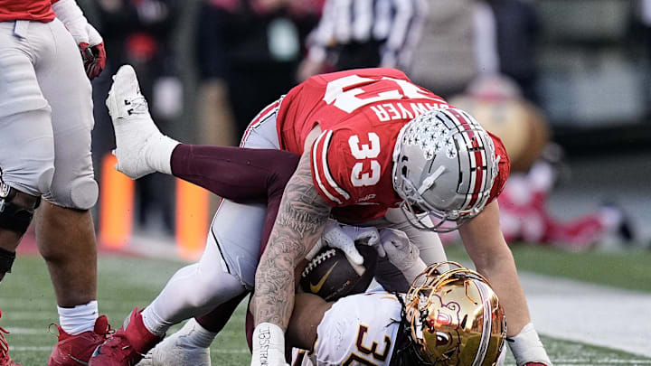 Nov 18, 2023; Columbus, Ohio, USA; Ohio State Buckeyes defensive end Jack Sawyer (33) tackles Minnesota Golden Gophers running back Jordan Nubin (30) during the first half of the NCAA football game at Ohio Stadium.