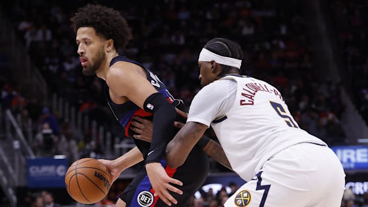 Nov 20, 2023; Detroit, Michigan, USA;  Detroit Pistons guard Cade Cunningham (2) dribbles defended