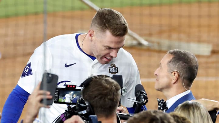Fox Sports field reporter Ken Rosenthal interviews Los Angeles Dodgers first baseman Freddie Freeman (5) after the win against the New York Yankees during game one of the 2024 MLB World Series at Dodger Stadium on Oct 25.