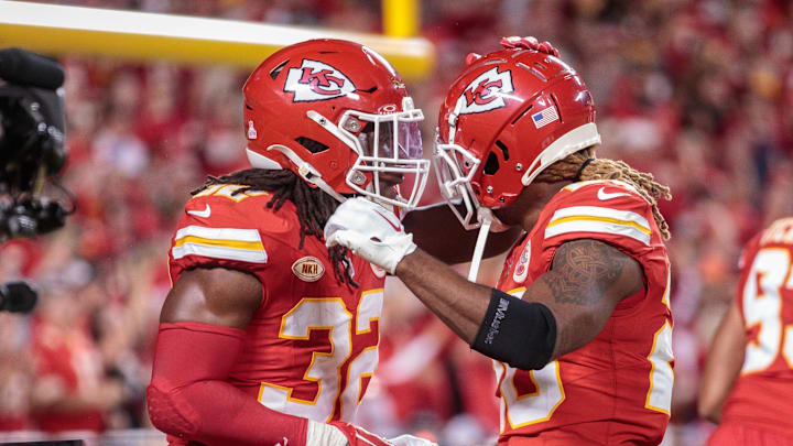 Oct 12, 2023; Kansas City, Missouri, USA; Kansas City Chiefs linebacker Nick Bolton (32) and Kansas City Chiefs safety Justin Reid (20) celebrate after a play during the third quarter against the Denver Broncos  at GEHA Field at Arrowhead Stadium. Mandatory Credit: William Purnell-Imagn Images