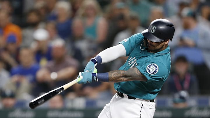 Seattle Mariners designated hitter Omar Narvaez (22) follows through on an RBI single against the Chicago White Sox during the first inning at T-Mobile Park in 2019. Seattle Mariners designated hitter Omar Narvaez (22) follows through on an RBI single against the Chicago White Sox during the first inning at T-Mobile Park in 2019.