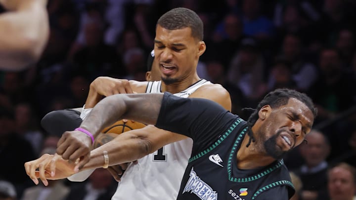 May 10, 2026; Minneapolis, Minnesota, USA; San Antonio Spurs center Victor Wembanyama (1) commits a level two flagrant foul against Minnesota Timberwolves center Naz Reid (11) in the second quarter of game four of the second round of the 2026 NBA Playoffs at Target Center. Wembanyama had to leave the game. Mandatory Credit: Bruce Kluckhohn-Imagn Images