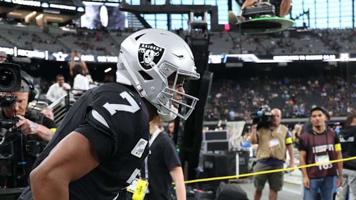 Sep 15, 2025; Paradise, Nevada, USA; Las Vegas Raiders quarterback Geno Smith (7) takes the field for warms ups before the game against the Los Angeles Chargers at Allegiant Stadium. Mandatory Credit: Kiyoshi Mio-Imagn Images