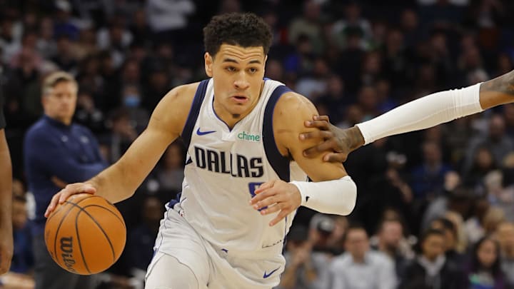 Jan 31, 2024; Minneapolis, Minnesota, USA; Dallas Mavericks guard Josh Green (8) drives up the court