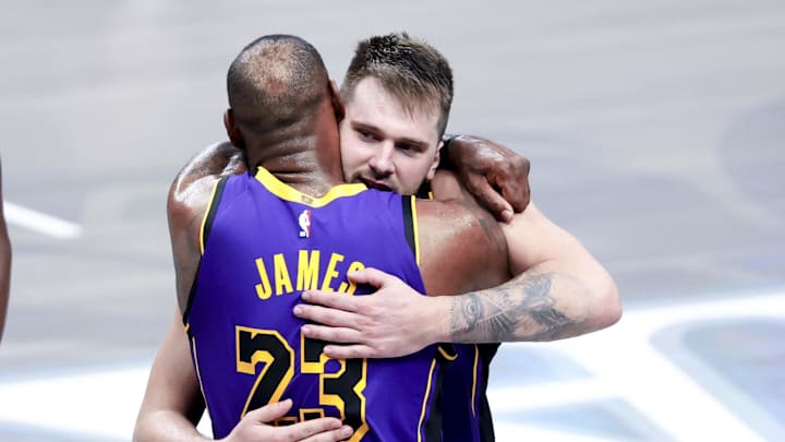 Apr 9, 2025; Dallas, Texas, USA;  Los Angeles Lakers guard Luka Doncic (77) celebrates with Los Angeles Lakers forward LeBron James (23) during the fourth quarter against the Dallas Mavericks at American Airlines Center. Mandatory Credit: Kevin Jairaj-Imagn Images