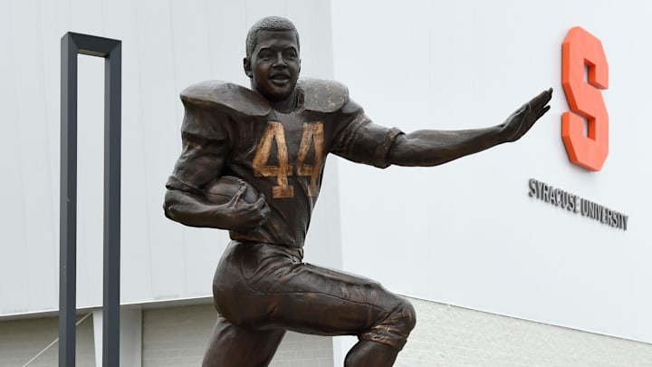 Dec 7, 2015; Syracuse, NY, USA; General view of a statue of Ernie Davis (not pictured) in Plaza 44 outside of the Clifford J. Ensley Athletic Center on the campus of Syracuse University following a press conference to introduce Dino Babers (not pictured) as the new head coach. Mandatory Credit: Rich Barnes-Imagn Images Dec 7, 2015; Syracuse, NY, USA; General view of a statue of Ernie Davis (not pictured) in Plaza 44 outside of the Clifford J. Ensley Athletic Center on the campus of Syracuse University following a press conference to introduce Dino Babers (not pictured) as the new head coach. Mandatory Credit: Rich Barnes-Imagn Images
