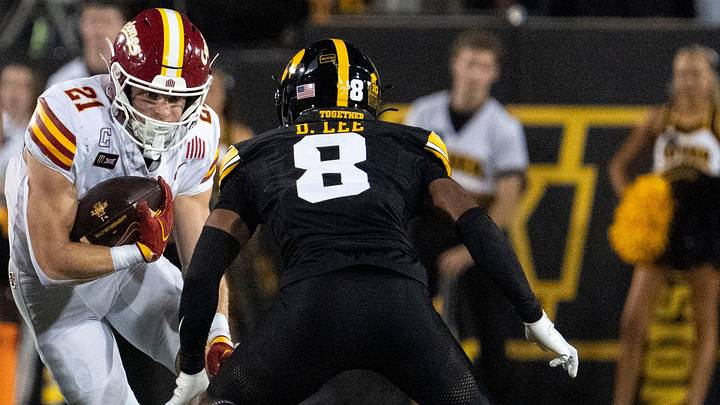 Iowa State running back Aiden Flora carries the ball as Iowa Hawkeyes defensive back Deshaun Lee (8) defends during the Cy-Hawk football game Sept. 12, 2026 at Kinnick Stadium in Iowa City, Iowa. Iowa State running back Aiden Flora carries the ball as Iowa Hawkeyes defensive back Deshaun Lee (8) defends during the Cy-Hawk football game Sept. 12, 2026 at Kinnick Stadium in Iowa City, Iowa.