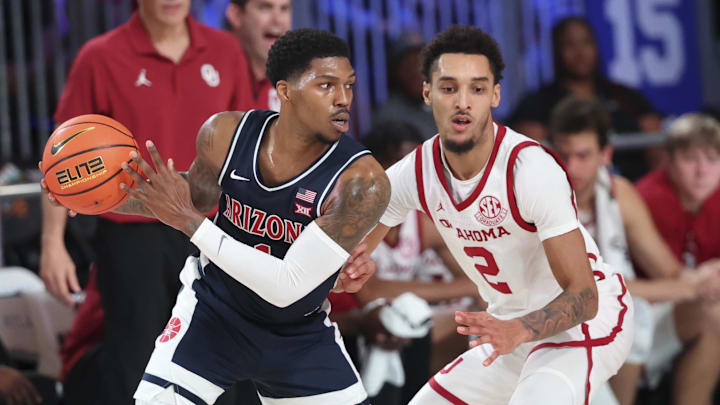 Nov 28, 2024;  Paradise Island, Bahamas, BHS; Arizona Wildcats guard Caleb Love (1) looks to score as Oklahoma Sooners guard Brycen Goodine (2) defends during the first half in the Imperial Arena at the Atlantis Resort.  Mandatory Credit: Kevin Jairaj-Imagn Images