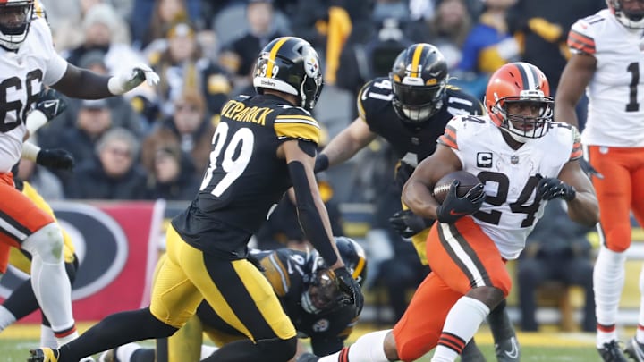 Jan 8, 2023; Pittsburgh, Pennsylvania, USA;  Cleveland Browns running back Nick Chubb (24) runs the ball against Pittsburgh Steelers safety Minkah Fitzpatrick (39) during the fourth quarter at Acrisure Stadium. Pittsburgh won 28-14. Mandatory Credit: Charles LeClaire-USA TODAY Sports