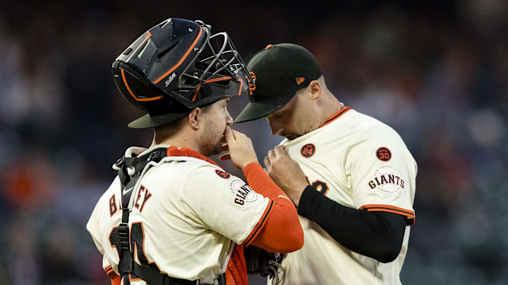Sep 11, 2024; San Francisco, California, USA; San Francisco Giants catcher Patrick Bailey (14) and starting pitcher Blake Snell (7) talk before a bass-loaded pitch against the Milwaukee Brewers during the second inning at Oracle Park. Mandatory Credit: John Hefti-Imagn Images Sep 11, 2024; San Francisco, California, USA; San Francisco Giants catcher Patrick Bailey (14) and starting pitcher Blake Snell (7) talk before a bass-loaded pitch against the Milwaukee Brewers during the second inning at Oracle Park. Mandatory Credit: John Hefti-Imagn Images