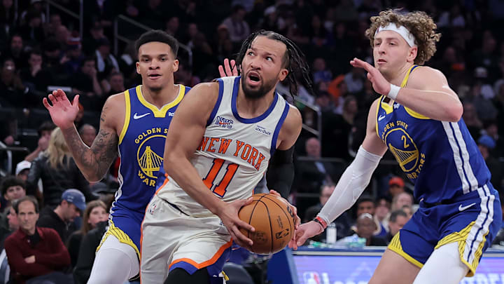 Mar 15, 2026; New York, New York, USA; New York Knicks guard Jalen Brunson (11) drives to the basket against Golden State Warriors guards Will Richard (3) and Brandin Podziemski (2) during the third quarter at Madison Square Garden. Mandatory Credit: Brad Penner-Imagn Images Mar 15, 2026; New York, New York, USA; New York Knicks guard Jalen Brunson (11) drives to the basket against Golden State Warriors guards Will Richard (3) and Brandin Podziemski (2) during the third quarter at Madison Square Garden. Mandatory Credit: Brad Penner-Imagn Images