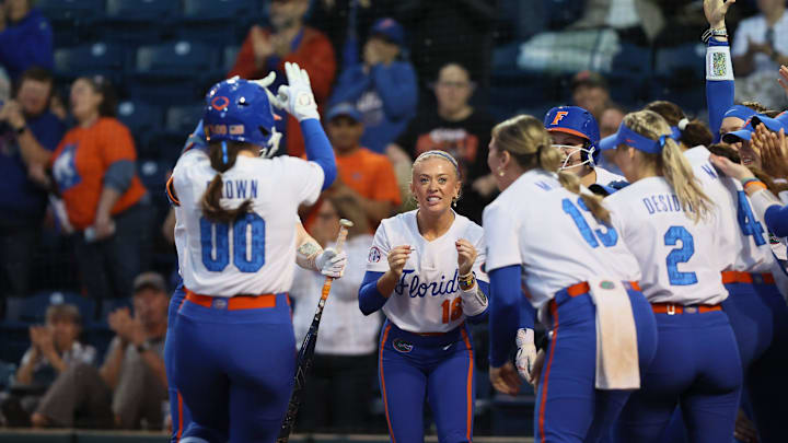Florida celebrates Florida starting pitcher/relief pitcher Ava Brown (00) home run during a NCAA softball game at Katie Seashole Pressly Stadium in Gainesville, FL on Wednesday, February 11, 2026. Florida beat Jacksonville in their home opener 11-1, [Alan Youngblood/Gainesville Sun]