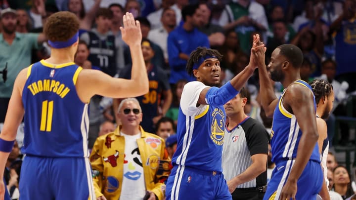 May 24, 2022; Dallas, Texas, USA; Golden State Warriors center Kevon Looney (5) high fives forward Draymond Green (23) after a play against the Dallas Mavericks during the first quarter in game four of the 2022 Western Conference finals at American Airlines Center. May 24, 2022; Dallas, Texas, USA; Golden State Warriors center Kevon Looney (5) high fives forward Draymond Green (23) after a play against the Dallas Mavericks during the first quarter in game four of the 2022 Western Conference finals at American Airlines Center.