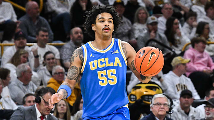 Jan 3, 2026; Iowa City, Iowa, USA; UCLA Bruins guard Skyy Clark (55) controls the ball against the Iowa Hawkeyes during the first half at Carver-Hawkeye Arena. Mandatory Credit: Jeffrey Becker-Imagn Images