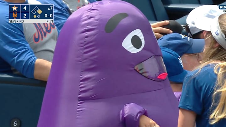 An inflatable Grimace at a Mets game.