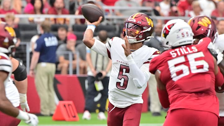 Sep 29, 2024; Glendale, Arizona, USA; Washington Commanders quarterback Jayden Daniels (5) throws in the first half against the Arizona Cardinals at State Farm Stadium. Mandatory Credit: Matt Kartozian-Imagn Images Sep 29, 2024; Glendale, Arizona, USA; Washington Commanders quarterback Jayden Daniels (5) throws in the first half against the Arizona Cardinals at State Farm Stadium. Mandatory Credit: Matt Kartozian-Imagn Images