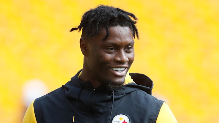 Pittsburgh Steelers wide receiver George Pickens smiles on the field before the game against the New England Patriots. Pittsburgh Steelers wide receiver George Pickens smiles on the field before the game against the New England Patriots.
