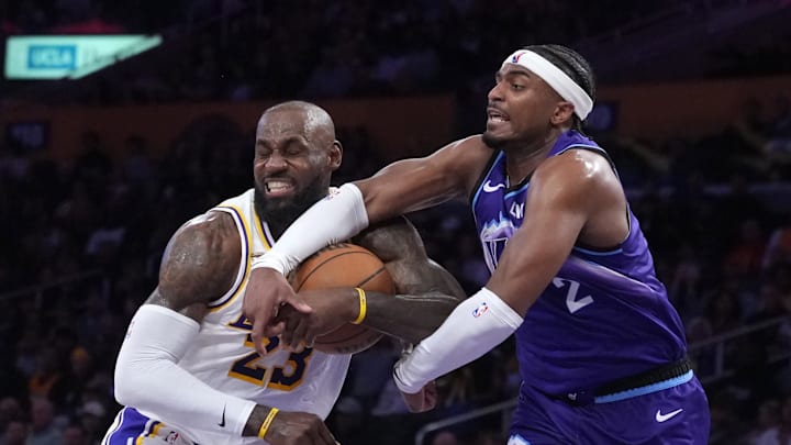 Apr 12, 2026; Los Angeles, California, USA; Los Angeles Lakers forward LeBron James (23) and Utah Jazz forward Blake Hinson (2) battle for the ball in the first half at Crypto.com Arena. Mandatory Credit: Kirby Lee-Imagn Images