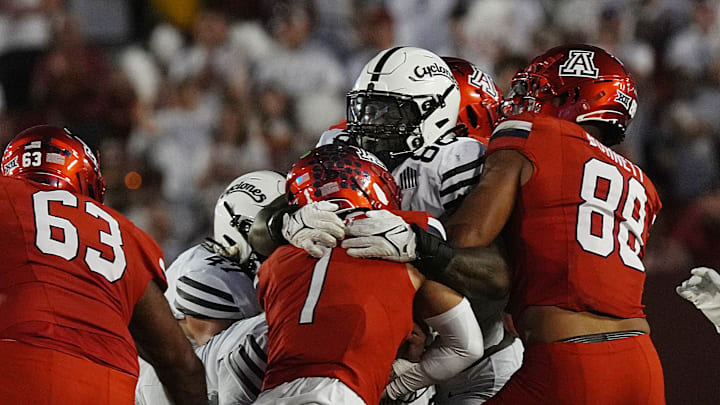 Iowa State Cyclones' defensive line Ikenna Ezeogu (88) takes down Arizona Wildcats quarterback Noah Fifita (1) during the second quarter in the Big-12 conference showdown on Sept. 27, 2025, at Jack Trice Stadium in Ames, Iowa.
