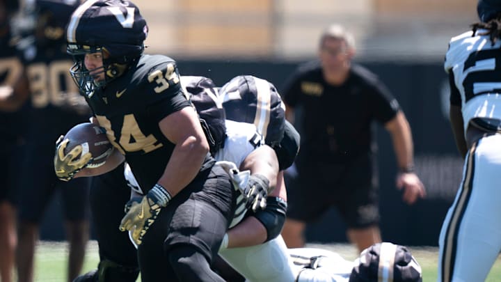 Vanderbilt running back Johann Cardenas (34) runs during the Vanderbilt Football Black and Gold Spring Game at FirstBank Stadium in Nashville, Tenn., Saturday, April 12, 2025.