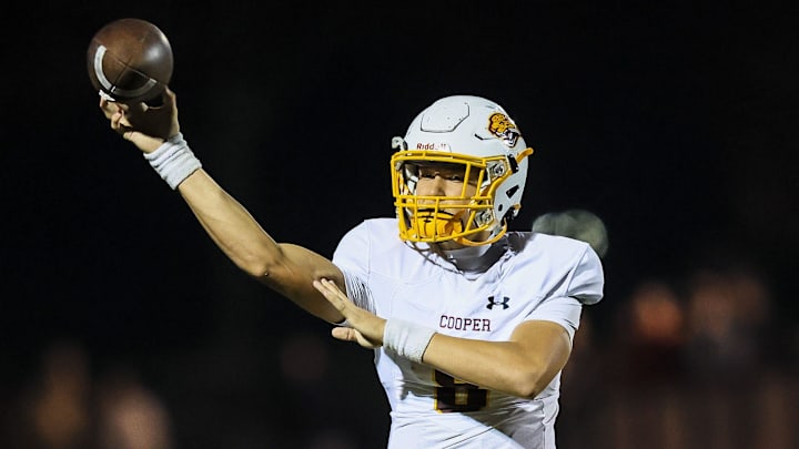 Cooper quarterback Cam O'Hara (8) throws a pass against Dixie Heights in the first half at Dixie Heights High School Oct. 25, 2024.