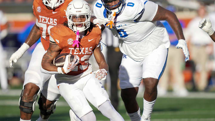 Texas Longhorns running back Jaydon Blue (23) looks for room to run against Kentucky Wildcats defense in the second quarter during the first half of an NCAA college football game at Darrell K Royal Texas Memorial Stadium, Austin, Texas, Saturday, Nov 24, 2024.