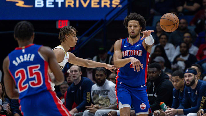 Nov 2, 2023; New Orleans, Louisiana, USA; Detroit Pistons guard Cade Cunningham (2) passes to guard Marcus Sasser (25) against New Orleans Pelicans guard Dyson Daniels (11) during the first half at the Smoothie King Center. Mandatory Credit: Stephen Lew-Imagn Images